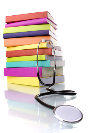 Pile of books and stethoscope 