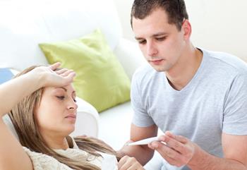 stock image of temperature being checked