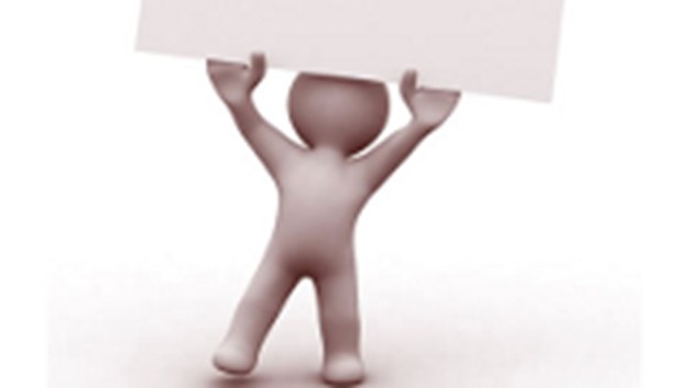 Image of figure holding up paper Image of figure holding up paper